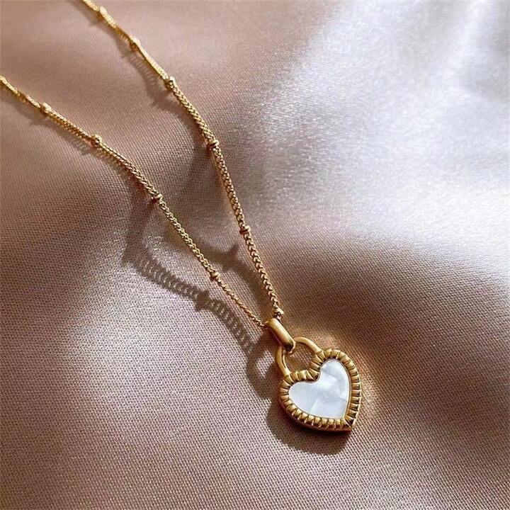 DOUBLE-SIDED HEART NECKLACE 18KT